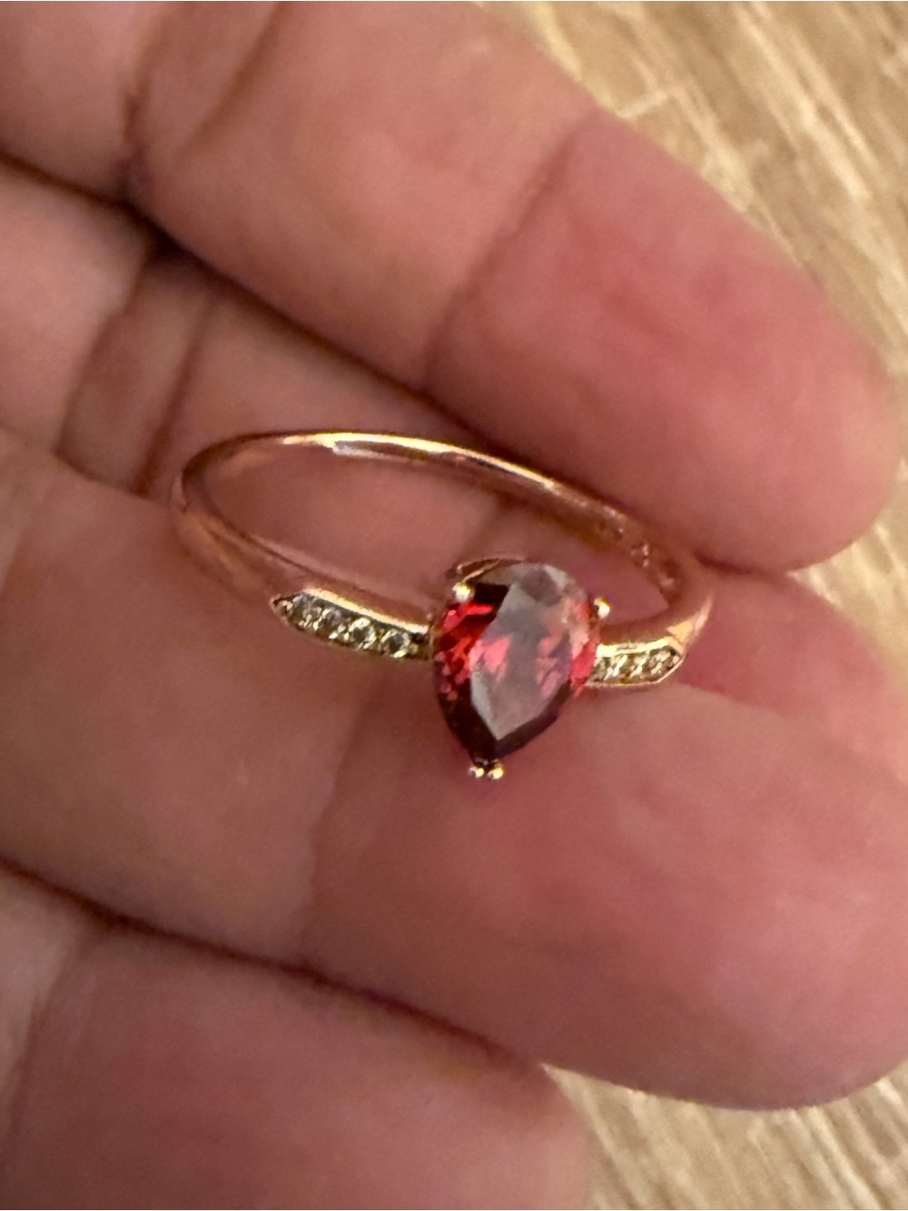 Rose Gold Pear-Cut Red Gemstone Ring with Accent Stones
